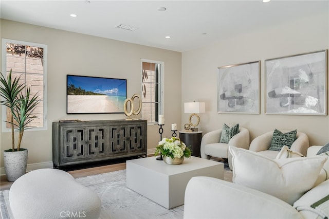 127 Toretta, Irvine, CA 92602 - living room featuring recessed lighting, wood finished floors, and baseboards