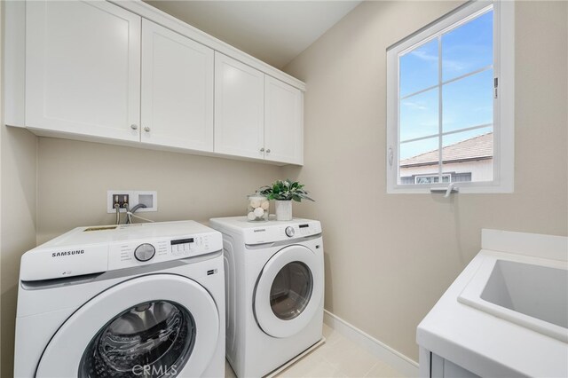 127 Toretta, Irvine, CA 92602 - washroom featuring cabinet space, separate washer and dryer, baseboards, and light tile patterned floors