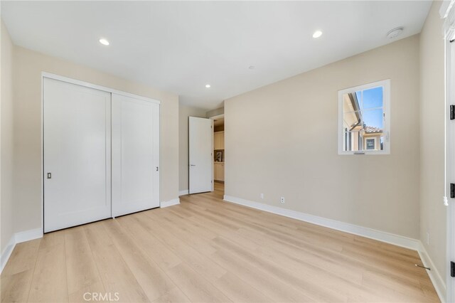127 Toretta, Irvine, CA 92602 - unfurnished bedroom with light wood-type flooring, baseboards, a closet, and recessed lighting