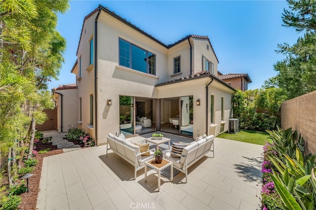 127 Toretta, Irvine, CA 92602 - rear view of property with outdoor lounge area, a patio, and stucco siding