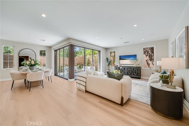 127 Toretta, Irvine, CA 92602 - living room featuring plenty of natural light, light wood-style floors, and recessed lighting