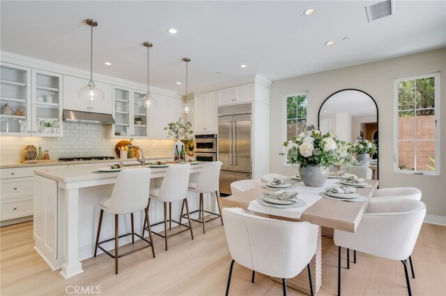 127 Toretta, Irvine, CA 92602 - dining space with light wood-style floors and recessed lighting