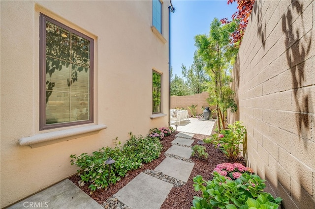 127 Toretta, Irvine, CA 92602 - view of home's exterior featuring stucco siding and a patio