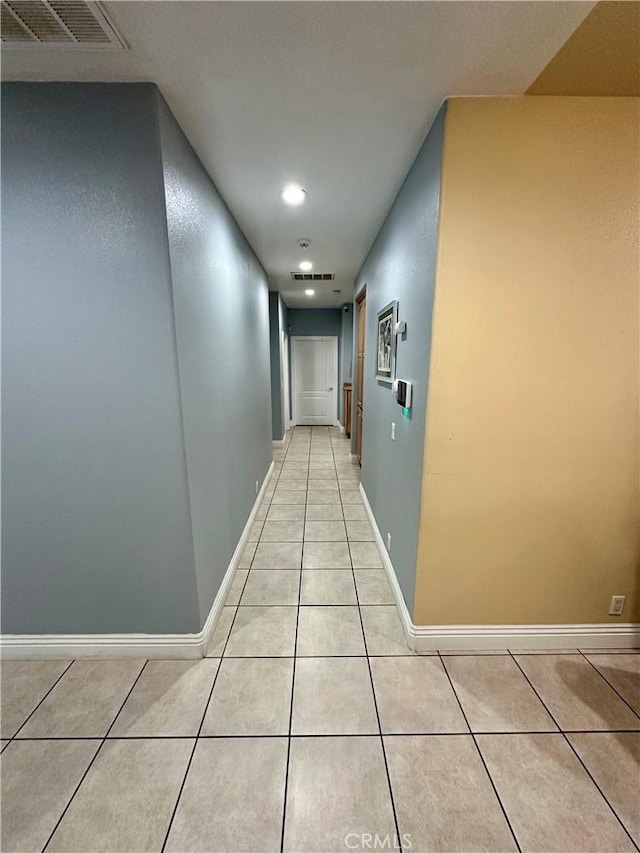 42500 20th St W, Lancaster, CA 93534 - hallway with light tile patterned floors, baseboards, and recessed lighting