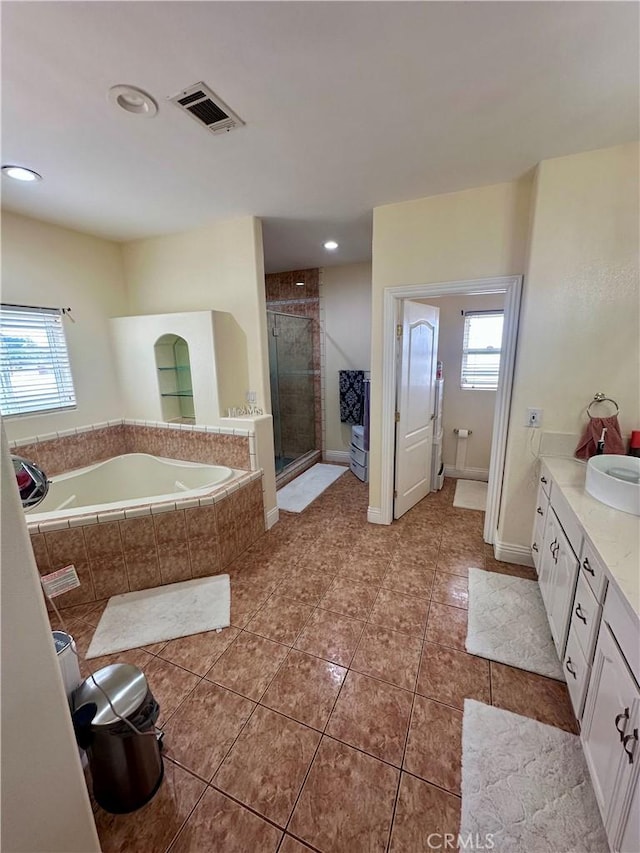42500 20th St W, Lancaster, CA 93534 - full bathroom featuring vanity, tile patterned flooring, a garden tub, a stall shower, and recessed lighting