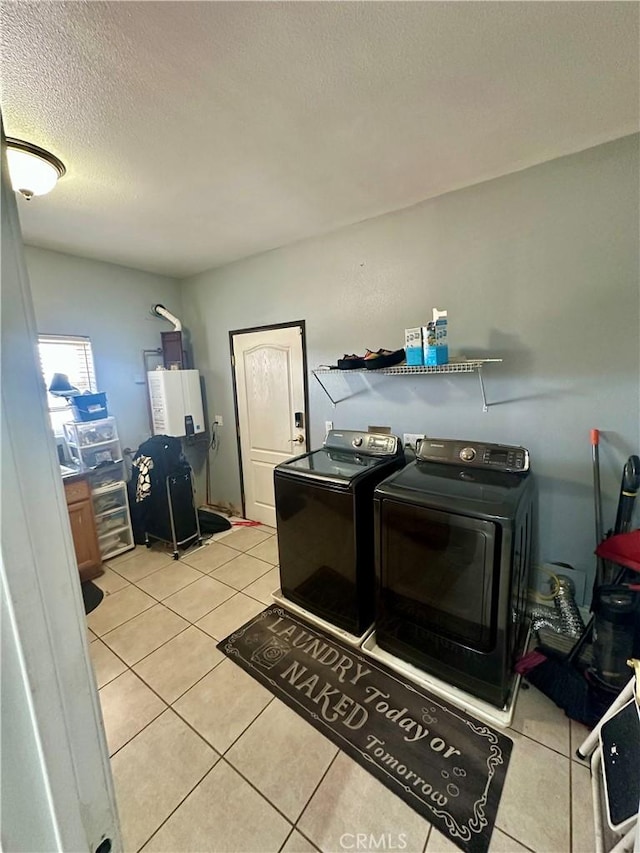 42500 20th St W, Lancaster, CA 93534 - laundry room with washer and dryer, light tile patterned floors, and a textured ceiling