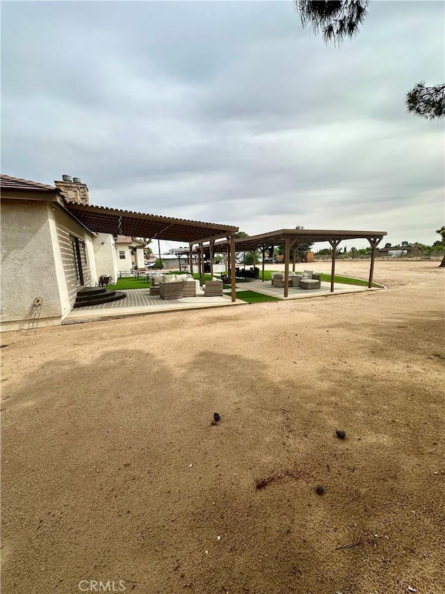 42500 20th St W, Lancaster, CA 93534 - surrounding community with a pergola, outdoor lounge area, and a patio area