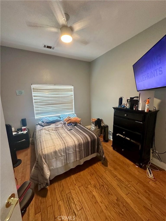 42500 20th St W, Lancaster, CA 93534 - bedroom with wood finished floors and a ceiling fan