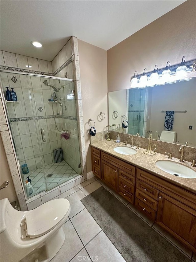 42500 20th St W, Lancaster, CA 93534 - bathroom with toilet, tile patterned flooring, a stall shower, and double vanity