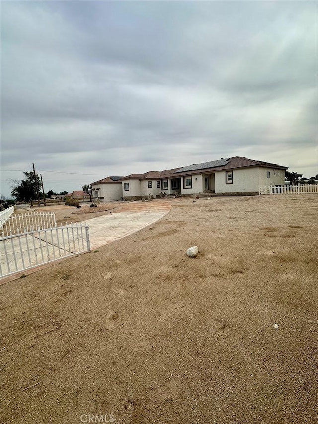 42500 20th St W, Lancaster, CA 93534 - view of front of property featuring roof mounted solar panels