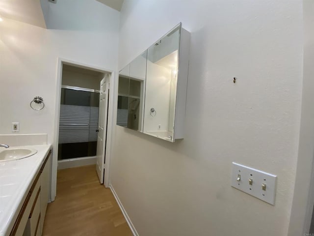 4793 Endeavor Ln, Carlsbad, CA 92008 - bathroom with wood finished floors, vanity, and baseboards
