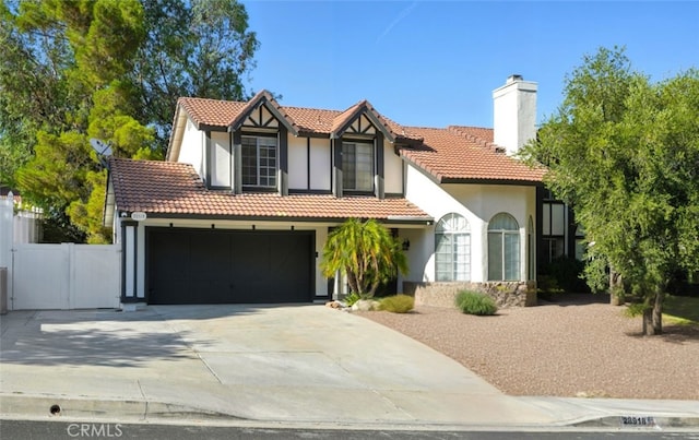 28918 Lillyglen Dr, Canyon Country, CA 91387 - view of front facade with a tiled roof, a chimney, stucco siding, and concrete driveway