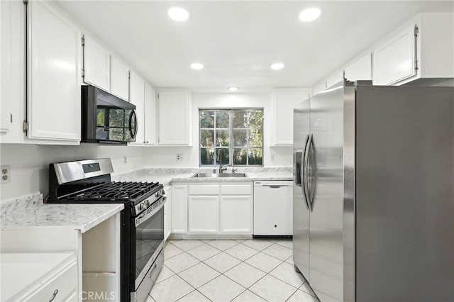 28918 Lillyglen Dr, Canyon Country, CA 91387 - kitchen with appliances with stainless steel finishes, light countertops, white cabinets, recessed lighting, and light tile patterned floors