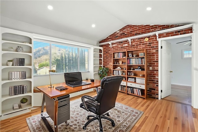 28918 Lillyglen Dr, Canyon Country, CA 91387 - office with lofted ceiling, brick wall, wood finished floors, and recessed lighting