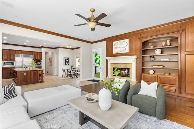 19103 Green Oaks Rd, Yorba Linda, CA 92886 - living room with ornamental molding, ceiling fan, a high end fireplace, recessed lighting, and built in shelves