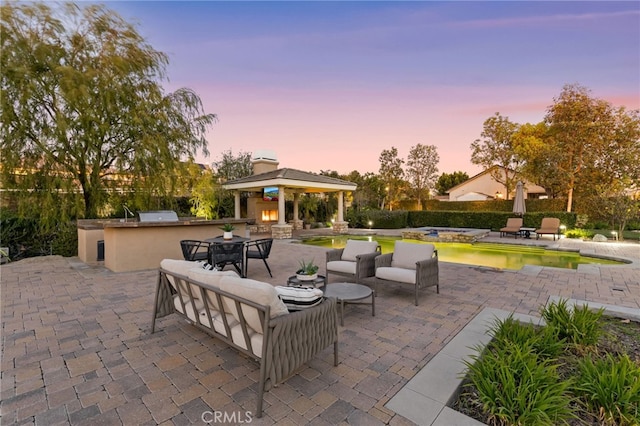 19103 Green Oaks Rd, Yorba Linda, CA 92886 - view of patio / terrace featuring a gazebo, exterior kitchen, outdoor dining space, and a pool with connected hot tub