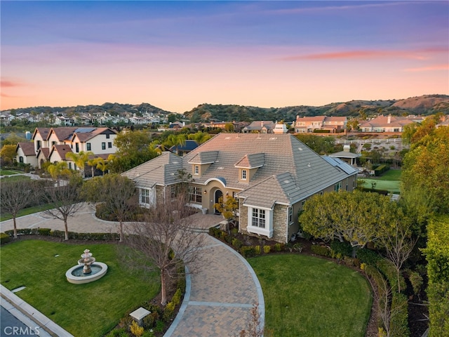 19103 Green Oaks Rd, Yorba Linda, CA 92886 - view of front of home featuring stone siding, a residential view, a front yard, and a tile roof