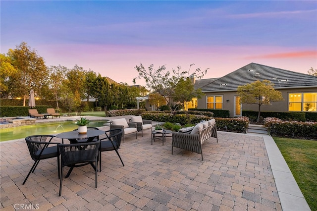 19103 Green Oaks Rd, Yorba Linda, CA 92886 - patio terrace at dusk featuring an outdoor hangout area, a patio, and a pool with connected hot tub