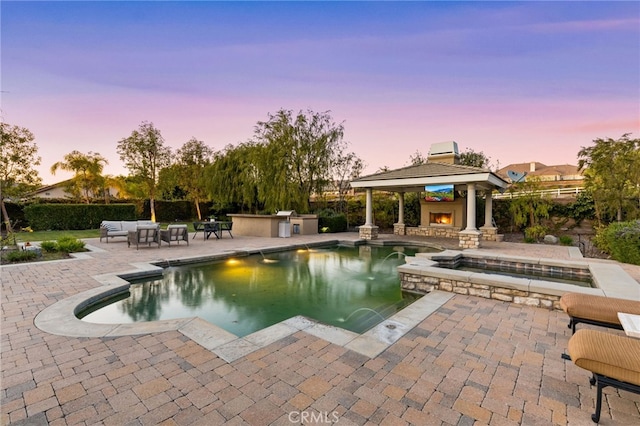 19103 Green Oaks Rd, Yorba Linda, CA 92886 - view of pool with a gazebo, a patio, a pool with connected hot tub, and an outdoor living space with a fireplace