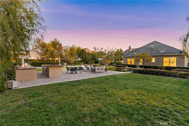 19103 Green Oaks Rd, Yorba Linda, CA 92886 - yard at dusk with a patio, a yard, and outdoor lounge area