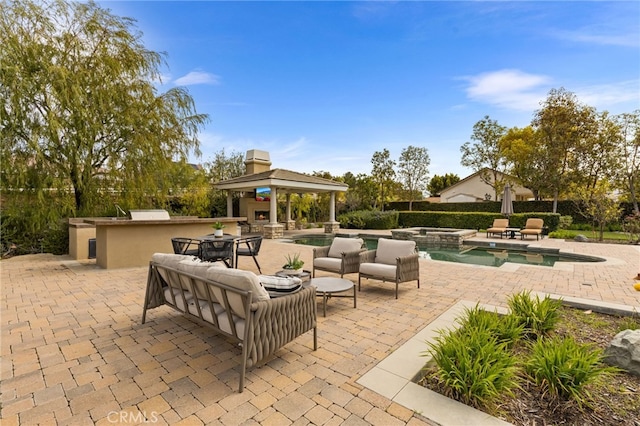 19103 Green Oaks Rd, Yorba Linda, CA 92886 - view of patio / terrace with a gazebo, a pool with connected hot tub, and exterior kitchen