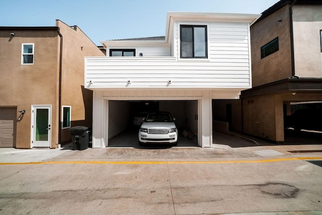 131 46th St, Newport Beach, CA 92663 - view of home's exterior featuring an attached garage and driveway