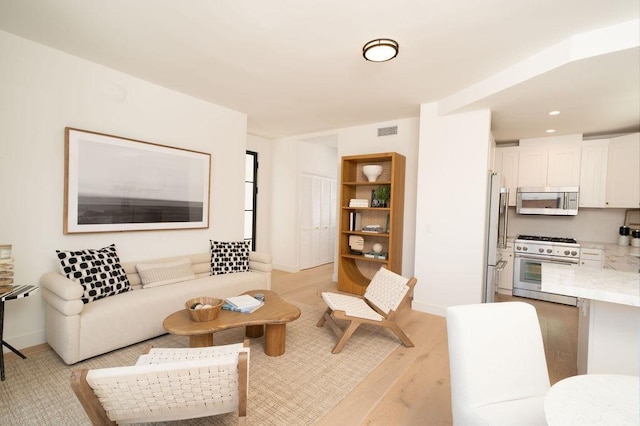 131 46th St, Newport Beach, CA 92663 - living area with light wood finished floors and baseboards
