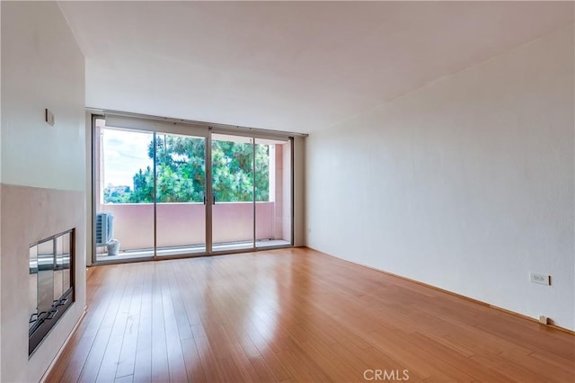 421 S La Fayette Park Pl Unit 701, Los Angeles, CA 90057 - unfurnished living room featuring wood finished floors