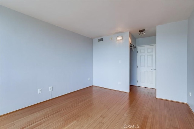 421 S La Fayette Park Pl Unit 701, Los Angeles, CA 90057 - unfurnished room with wood finished floors and baseboards