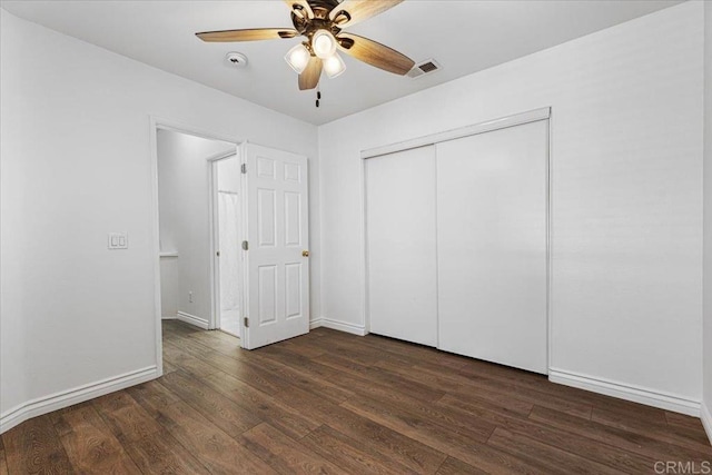 645 Sumner Way Unit 3, Oceanside, CA 92058 - unfurnished bedroom with dark wood-style floors, a closet, and a ceiling fan