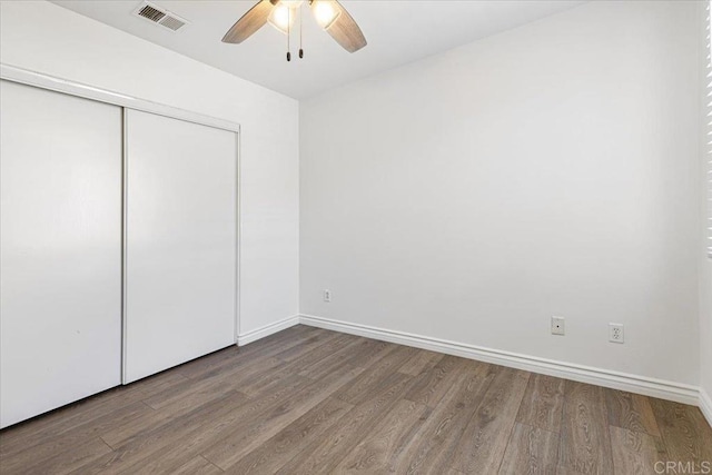 645 Sumner Way Unit 3, Oceanside, CA 92058 - unfurnished bedroom featuring wood finished floors, a closet, and a ceiling fan
