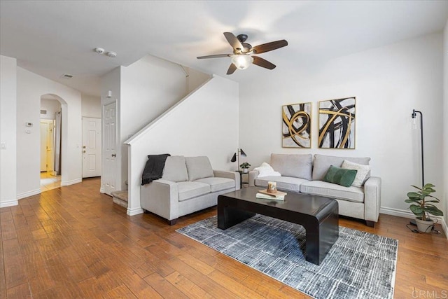 645 Sumner Way Unit 3, Oceanside, CA 92058 - living area featuring a ceiling fan, arched walkways, wood finished floors, and stairs