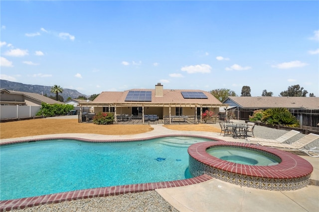 32642 Durango Ct, Wildomar, CA 92595 - view of pool with an in-ground hot tub, a patio, outdoor dining space, a fenced backyard, and a mountain view