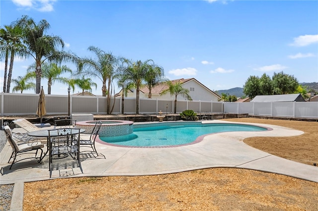 32642 Durango Ct, Wildomar, CA 92595 - view of pool with a fenced backyard, a patio, a pool with connected hot tub, and a mountain view