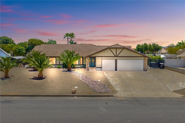 32642 Durango Ct, Wildomar, CA 92595 - view of front facade featuring driveway, a garage, and stucco siding