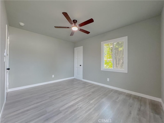 1976 E 112th St, Los Angeles, CA 90059 - spare room with ceiling fan, baseboards, light wood-style flooring, and a smoke detector