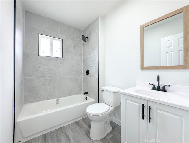 1976 E 112th St, Los Angeles, CA 90059 - bathroom featuring wood finished floors, vanity, toilet, bathing tub / shower combination, and baseboards