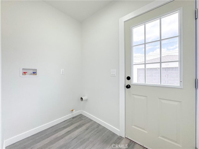 1976 E 112th St, Los Angeles, CA 90059 - laundry room with baseboards, hookup for a washing machine, light wood-type flooring, and hookup for a gas dryer