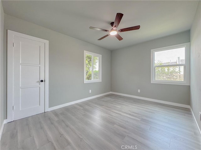 1976 E 112th St, Los Angeles, CA 90059 - unfurnished room featuring ceiling fan, light wood finished floors, and baseboards