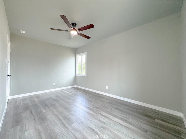 1976 E 112th St, Los Angeles, CA 90059 - spare room with a ceiling fan, wood finished floors, baseboards, and a smoke detector
