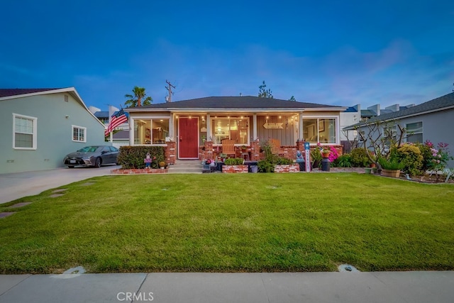 4002 Camerino St, Lakewood, CA 90712 - view of front of home featuring a front yard, a porch, and board and batten siding