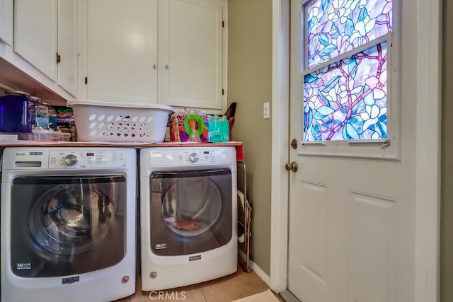 4002 Camerino St, Lakewood, CA 90712 - washroom featuring cabinet space, washing machine and dryer, and light tile patterned floors