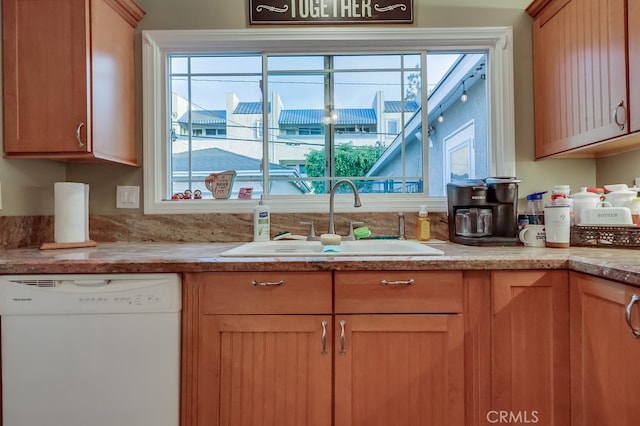4002 Camerino St, Lakewood, CA 90712 - kitchen featuring white dishwasher, a sink, and healthy amount of natural light