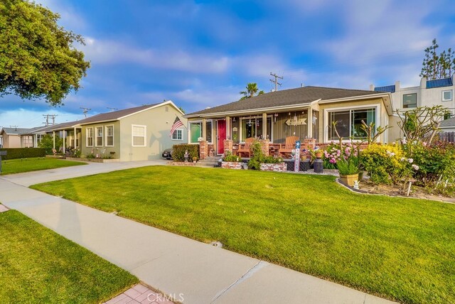 4002 Camerino St, Lakewood, CA 90712 - single story home with a porch, a front lawn, and stucco siding