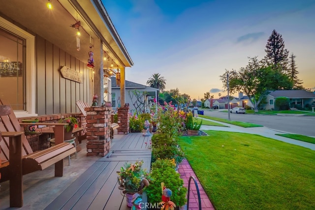 4002 Camerino St, Lakewood, CA 90712 - deck at dusk with a yard