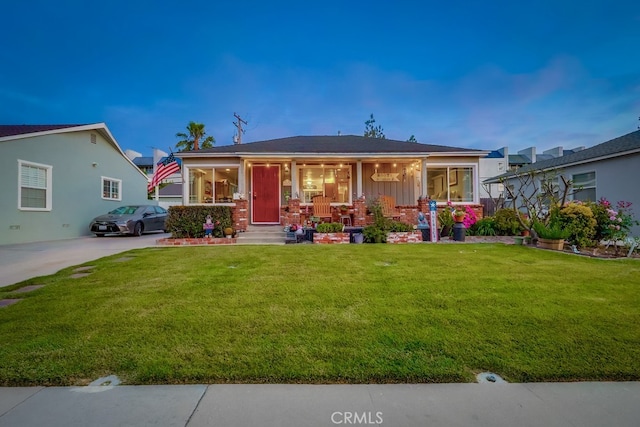 4002 Camerino St, Lakewood, CA 90712 - view of front facade with a front lawn, covered porch, and board and batten siding