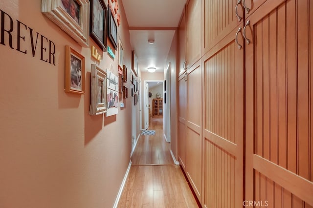 4002 Camerino St, Lakewood, CA 90712 - corridor featuring light wood finished floors