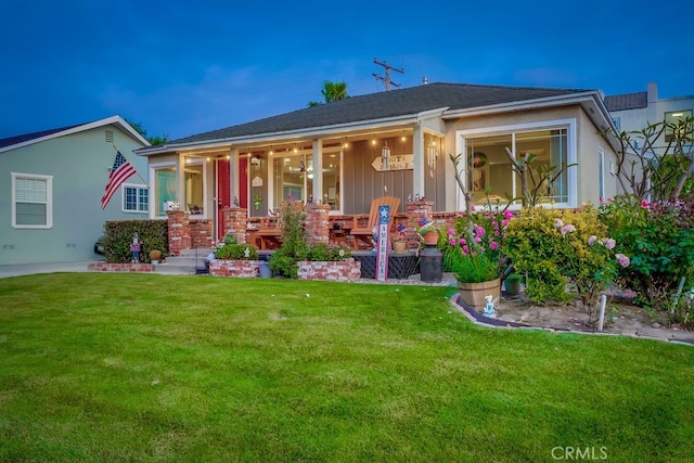 4002 Camerino St, Lakewood, CA 90712 - view of front of home featuring covered porch and a front yard