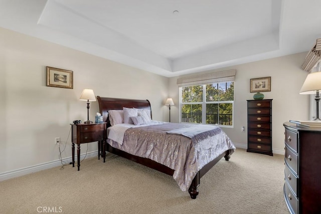 13200 Moorpark St Unit 201, Sherman Oaks, CA 91423 - bedroom with a tray ceiling, light carpet, and baseboards