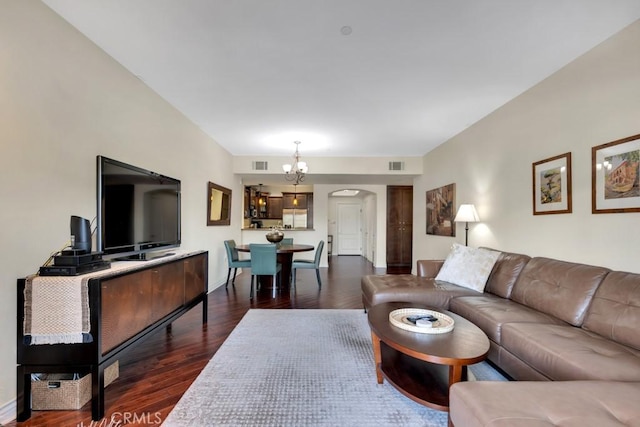 13200 Moorpark St Unit 201, Sherman Oaks, CA 91423 - living area with arched walkways, dark wood finished floors, and a chandelier